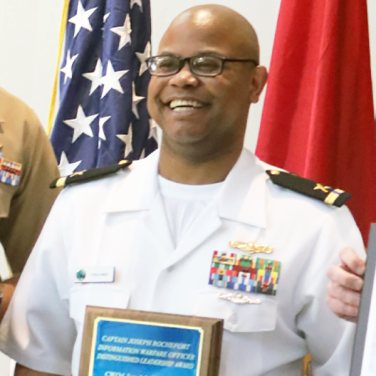 Presented to CWO4 Jarvis J. Ware, USN
