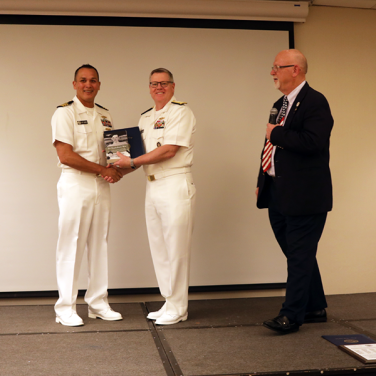 Presented to CDR Jeffrey L. Burke, USN, NIOC Hawaii by RADM Daniel J. MacDonnel, Deputy Chief, Central Security Service, National Security Agency
