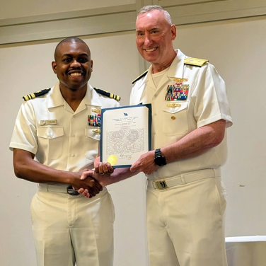 Presented to Lieutenant Commander Corey O. Grey, USN by VADM H. K. Berg, Commander, U.S. Fleet Cyber Command and U.S. TENTH Fleet