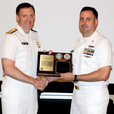 Presented to CTMCS(IDW/SS) Michael J. Bunnell  by VADM M. Rogers