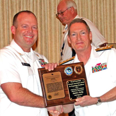Presented to CTMC(SG) David Hurley by RADM Deets