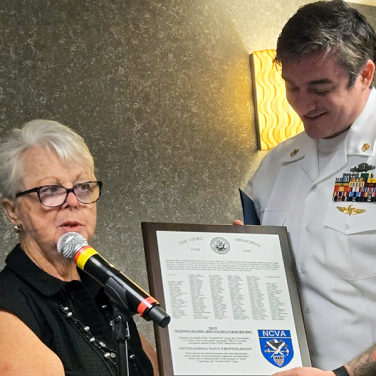 Presented to CTRC Joseph A. Brown, USN, Naval Special Warfare Development Group, by US NCVA Executive Director, Penny Tardona