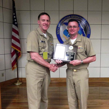 Presented to LCDR Lemuel 'Seth' Lawrence by VADM Rogers