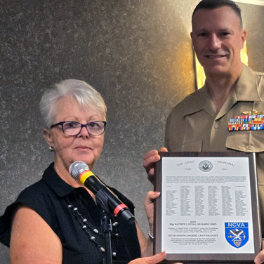 Presented to MSgt Matthew G. Duvall, HQ Marine Corps, by US NCVA Executive Director, Penny Tardona