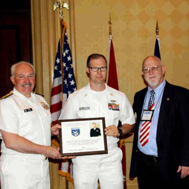 Presented to CTMCS(IDW) Ricky L. Pottebaum by RADM J. Clusen and Bill Hickey