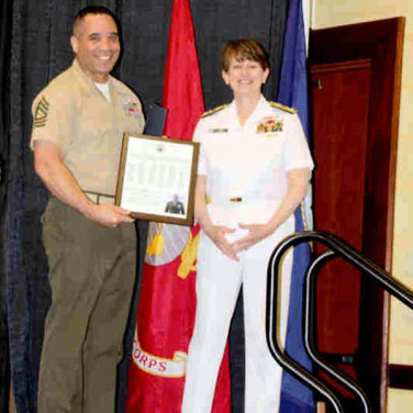 Presented to MSGT Leon Ramowith by VADM J. Tighe