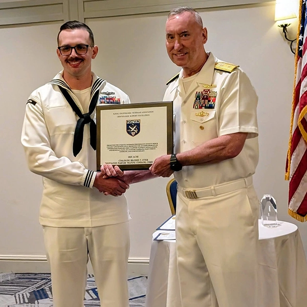 Presented to Lieutenant Commander Corey O. Grey, USN  by RADM Harding